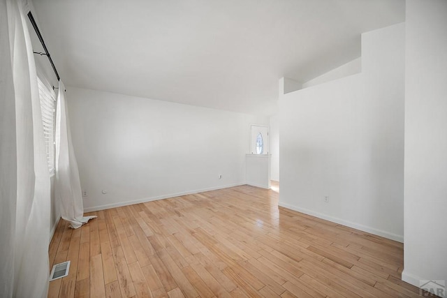 130 Montcalm Dr, Pueblo, CO 81005 - additional living space with light wood-style floors, a barn door, and lofted ceiling