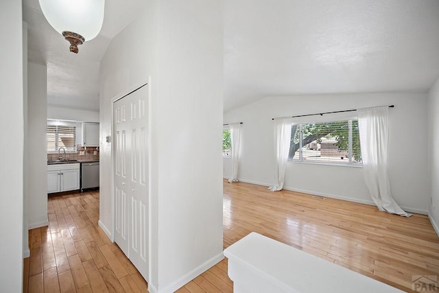 130 Montcalm Dr, Pueblo, CO 81005 - corridor featuring lofted ceiling and light wood-type flooring