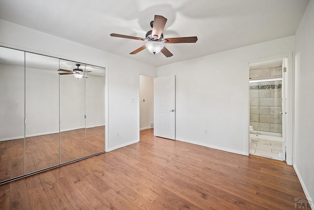 130 Montcalm Dr, Pueblo, CO 81005 - unfurnished bedroom featuring wood finished floors, a closet, ensuite bathroom, and a ceiling fan