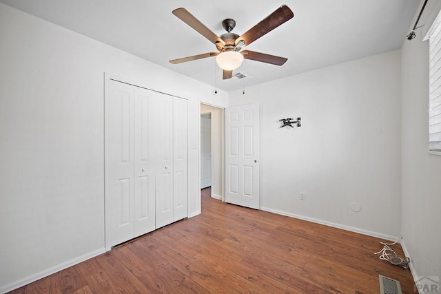 130 Montcalm Dr, Pueblo, CO 81005 - unfurnished bedroom with wood finished floors, a closet, and ceiling fan