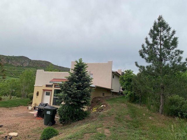 2075 County Rd 389th Rd, Wetmore, CO 81253 - view of side of home featuring stucco siding and a mountain view