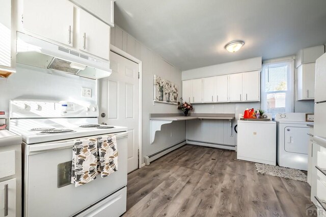 kitchen with electric stove, light countertops, under cabinet range hood, washing machine and dryer, and white cabinetry