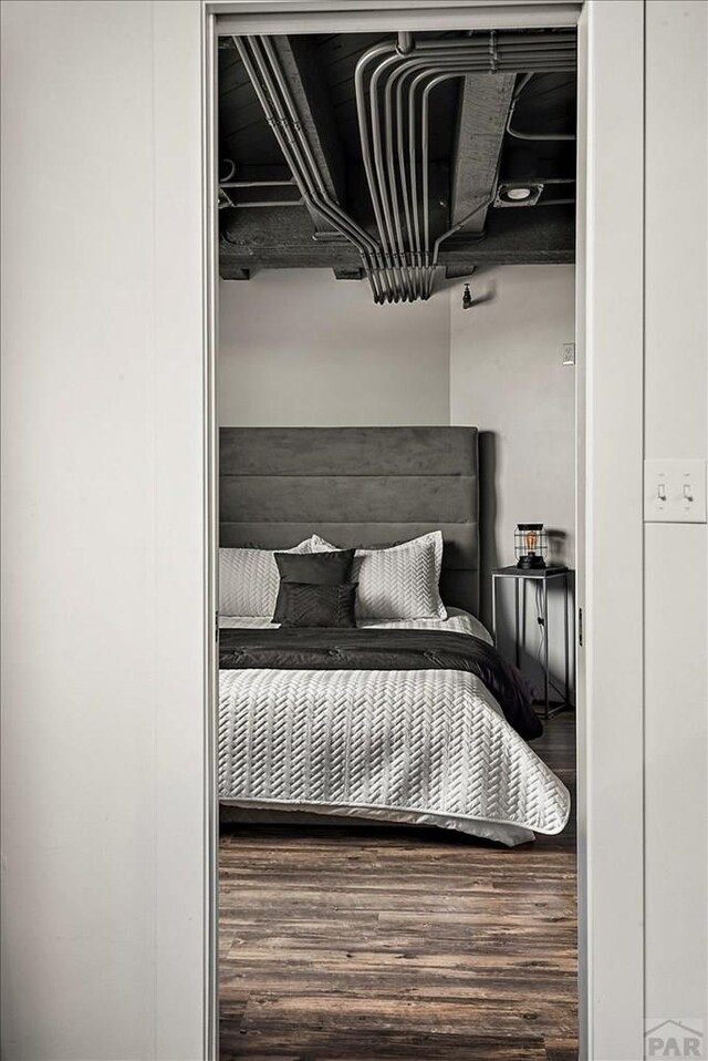 bedroom featuring wood finished floors