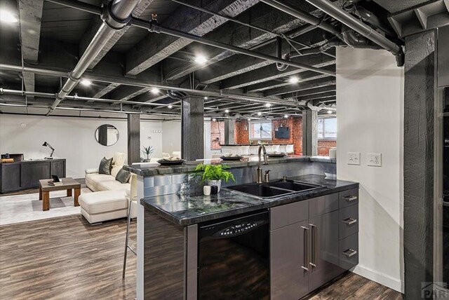 kitchen with a sink, black dishwasher, open floor plan, dark wood-style floors, and modern cabinets