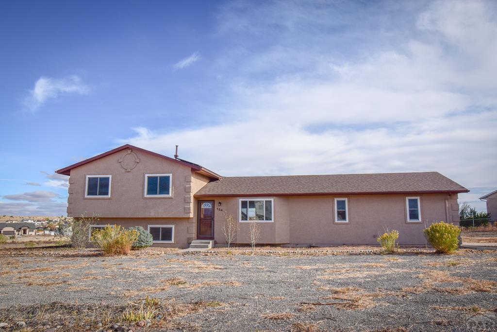 tri-level home featuring stucco siding