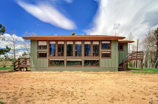 749 Aspen Village Rd, Divide, CO 80814 - back of property with stairs and a wooden deck