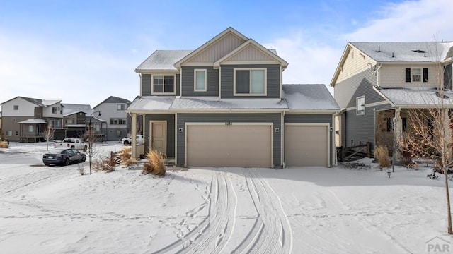 view of front of home with a garage, board and batten siding, and a residential view