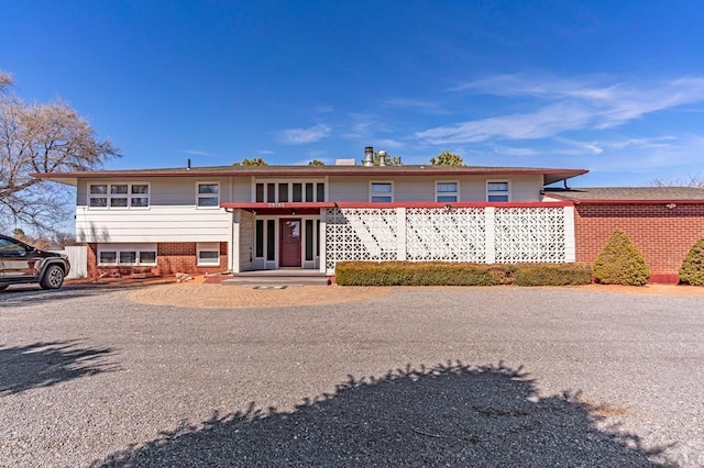 view of front of house featuring brick siding