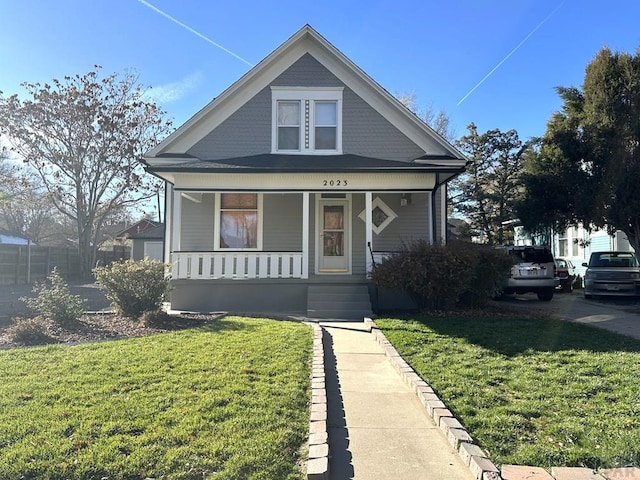2023 N Elizabeth St, Pueblo, CO 81003 - bungalow-style house featuring a porch and a front yard