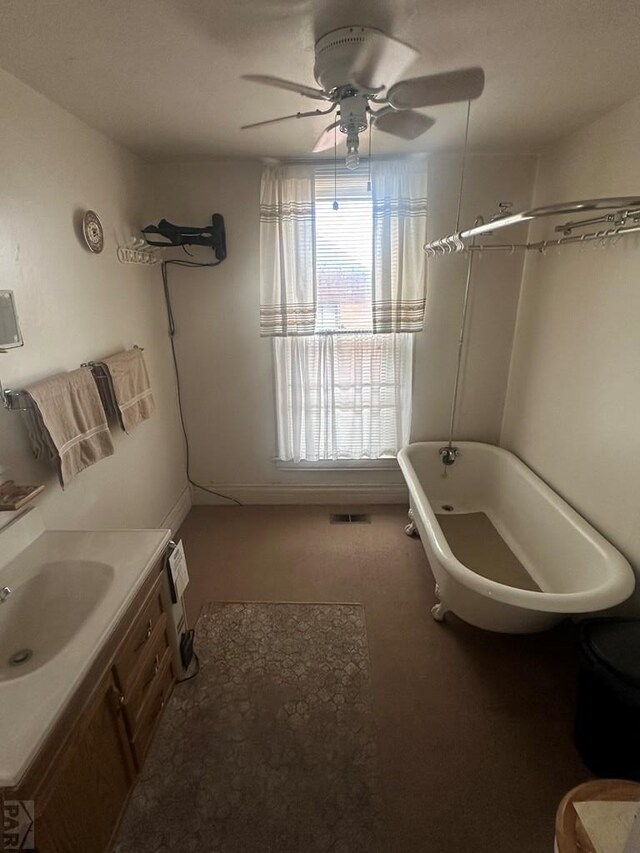 full bath with a ceiling fan, carpet, and vanity