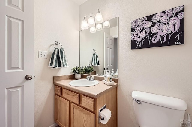 3603 Bobcat Ln, Pueblo, CO 81005 - half bathroom with toilet and vanity