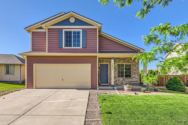 3603 Bobcat Ln, Pueblo, CO 81005 - traditional home featuring a garage, concrete driveway, and covered porch