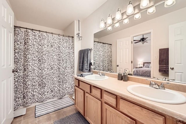 3603 Bobcat Ln, Pueblo, CO 81005 - full bathroom featuring a ceiling fan, double vanity, connected bathroom, and tile patterned flooring