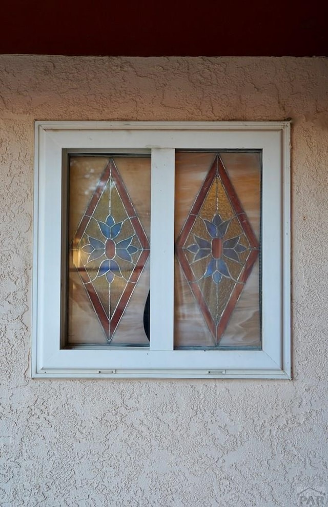 details featuring stucco siding