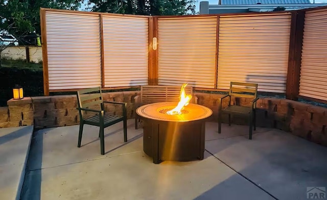 view of patio / terrace with an outdoor fire pit