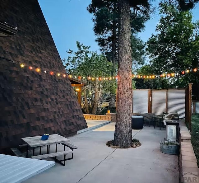 view of patio featuring fence