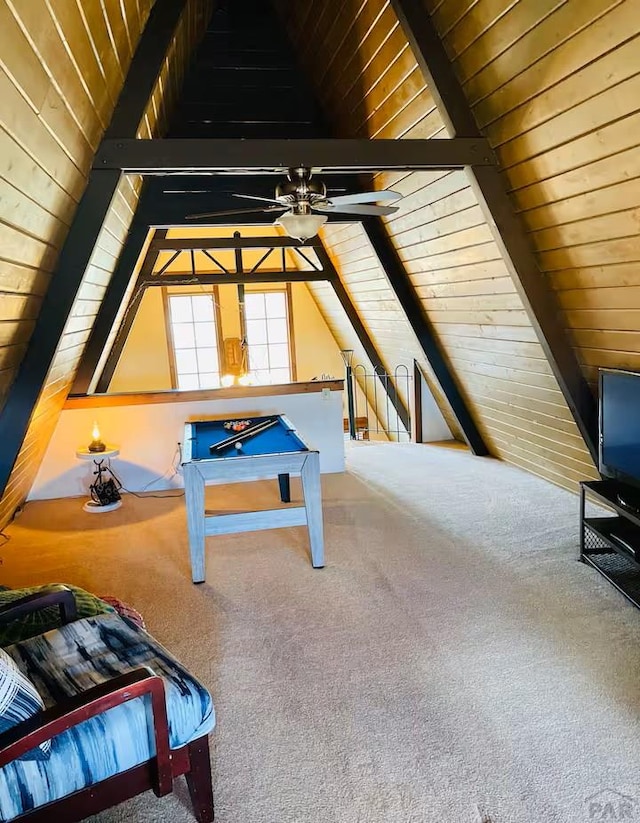 recreation room featuring vaulted ceiling with beams, ceiling fan, carpet, and wood ceiling