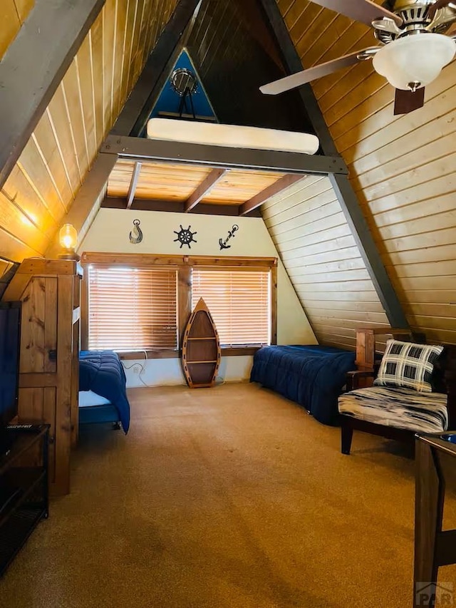 carpeted bedroom featuring lofted ceiling with beams and wooden ceiling