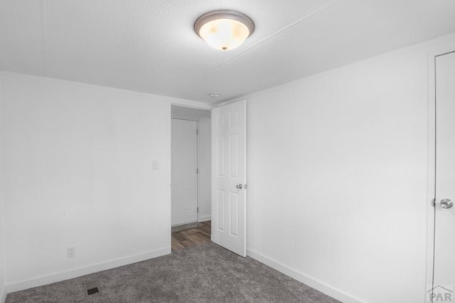 400 Hickory St Unit 172, Fort Collins, CO 80524 - unfurnished room with baseboards and carpet flooring