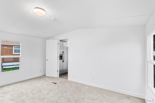 400 Hickory St Unit 172, Fort Collins, CO 80524 - interior space with vaulted ceiling, baseboards, visible vents, and carpet floors