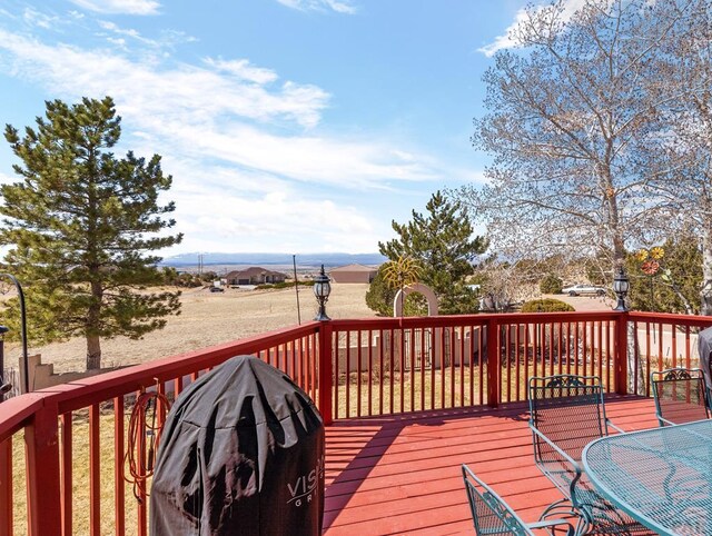 wooden deck featuring area for grilling