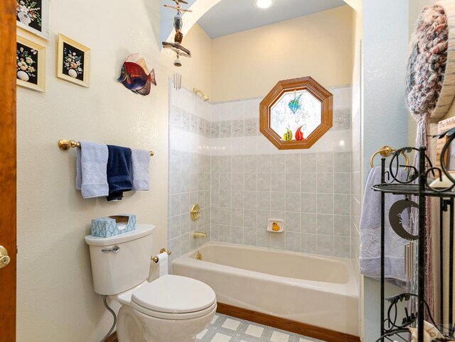 full bath with shower / bath combination and toilet