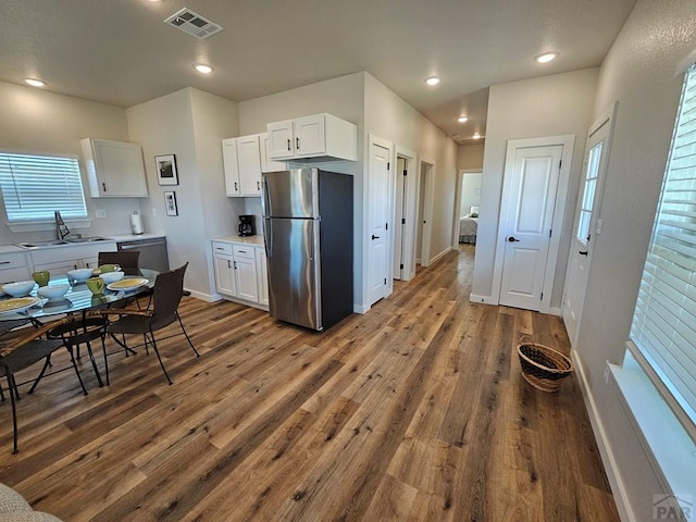28781 County Rd 24.6, Springfield, CO 81073 - kitchen featuring freestanding refrigerator, a sink, dark wood-style floors, white cabinetry, and recessed lighting
