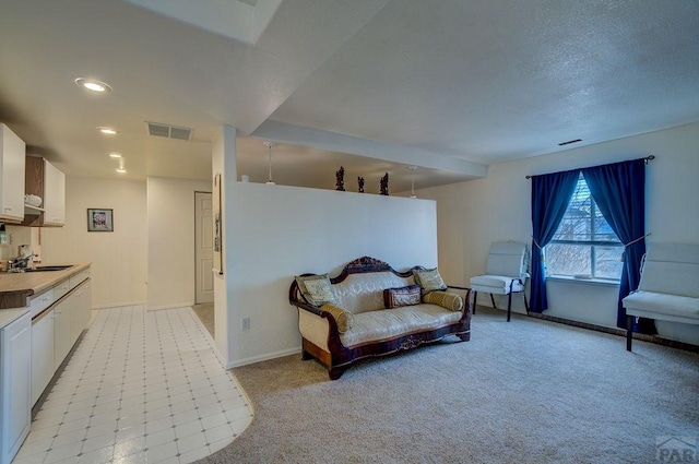 sitting room featuring recessed lighting, visible vents, light carpet, and baseboards