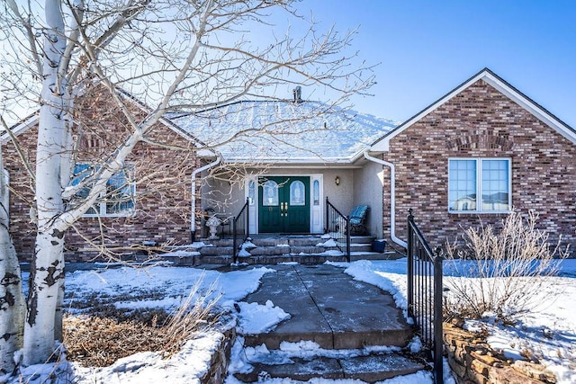 view of front of home featuring brick siding