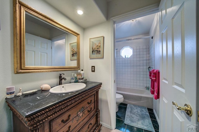 full bath featuring baseboards, toilet, tile patterned floors, vanity, and shower / washtub combination