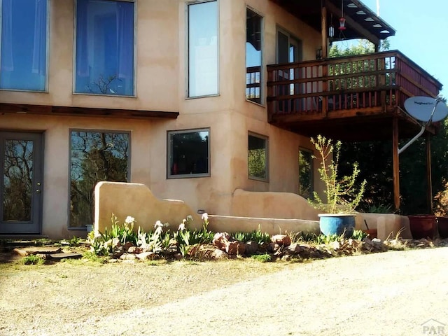 840 County Rd 627, Gardner, CO 81040 - view of side of property featuring stucco siding and a deck