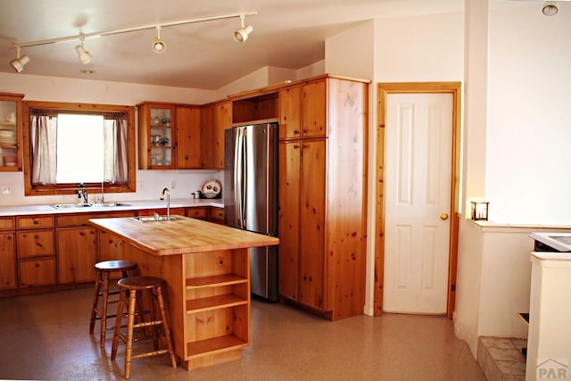840 County Rd 627, Gardner, CO 81040 - kitchen featuring wooden counters, freestanding refrigerator, a sink, and a kitchen island with sink