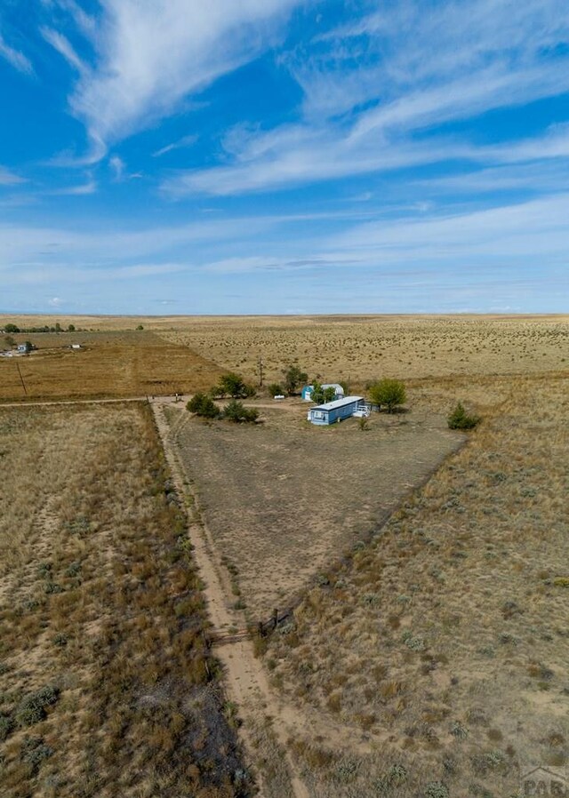 birds eye view of property featuring a rural view