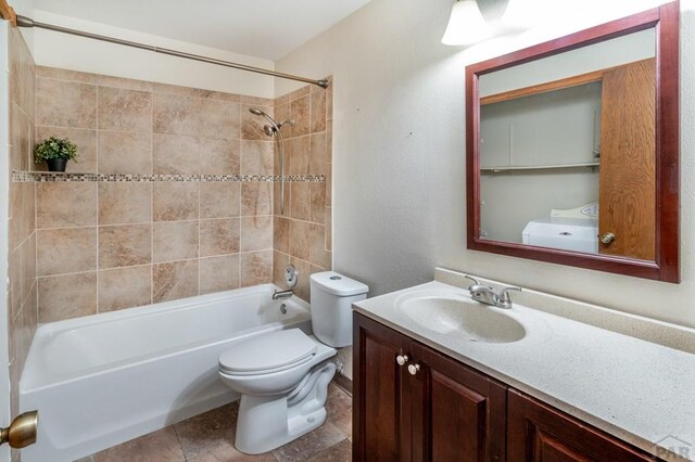 bathroom with shower / bath combination, vanity, and toilet