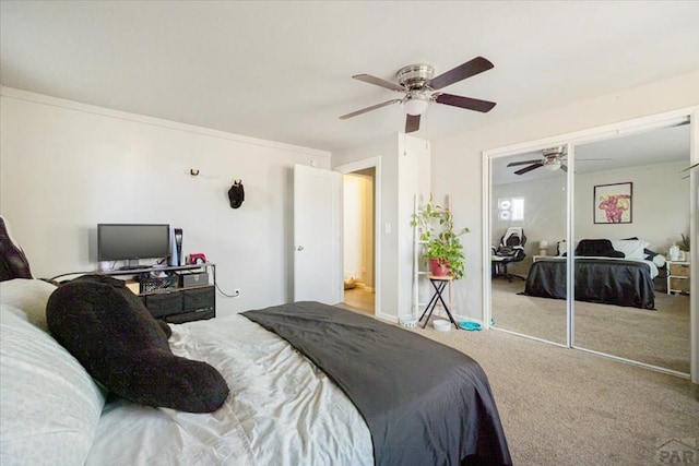 bedroom featuring a closet, carpet flooring, and ceiling fan