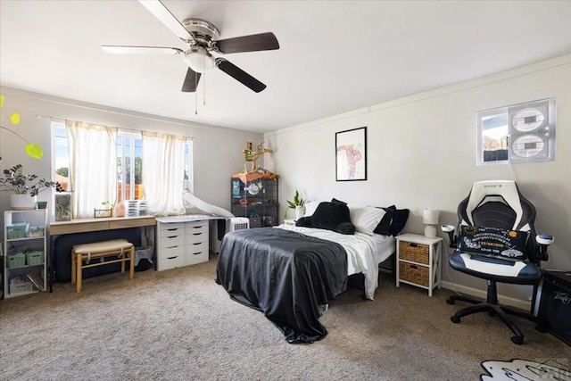 bedroom featuring a ceiling fan and carpet floors