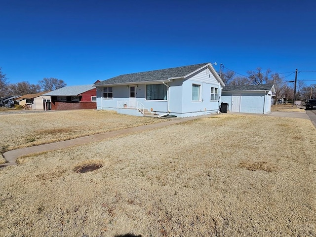 view of front of home with an outdoor structure