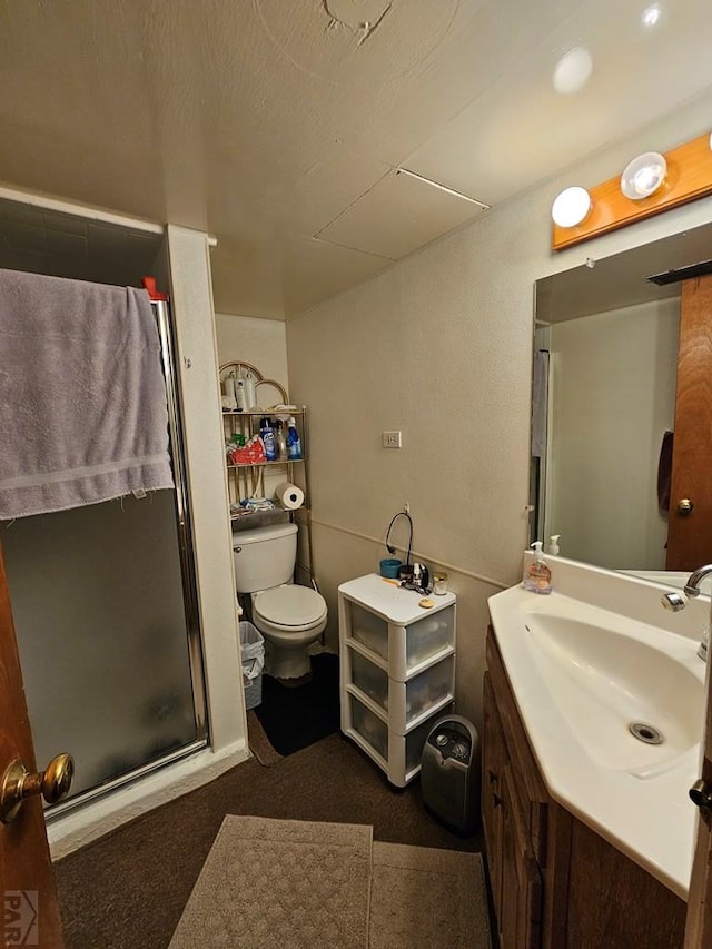 full bathroom with toilet, a stall shower, and vanity