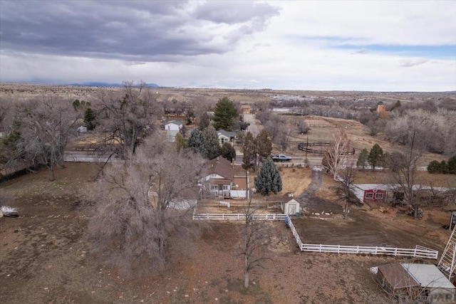 birds eye view of property with a rural view