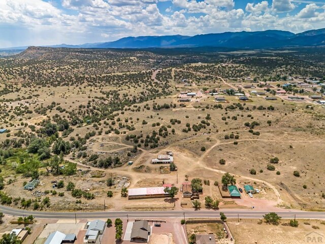 bird's eye view with view of desert and a mountain view