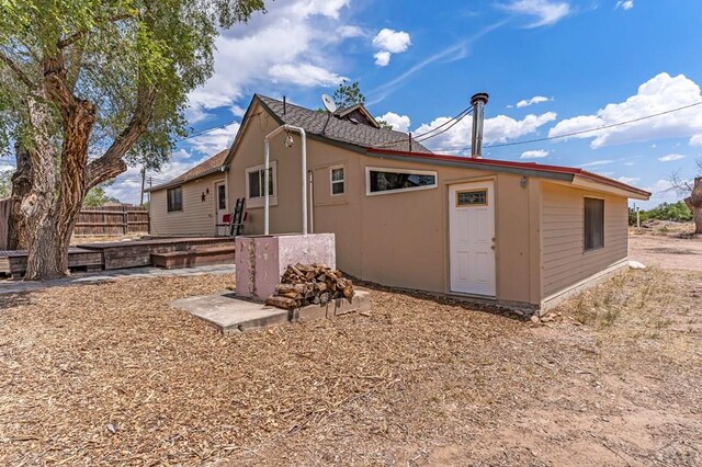 view of property exterior featuring fence