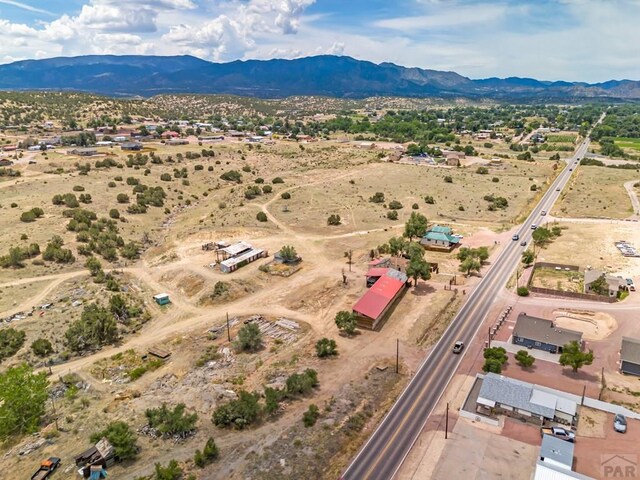 bird's eye view with a desert view and a mountain view