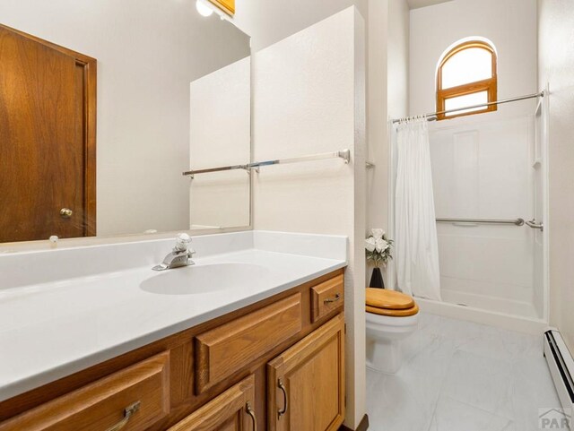 bathroom featuring toilet, a shower stall, baseboard heating, and vanity