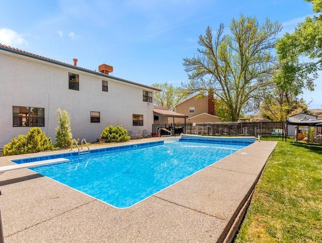 view of pool featuring a fenced in pool, fence, and a lawn