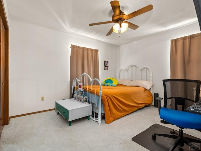 bedroom with baseboards, a ceiling fan, and light colored carpet