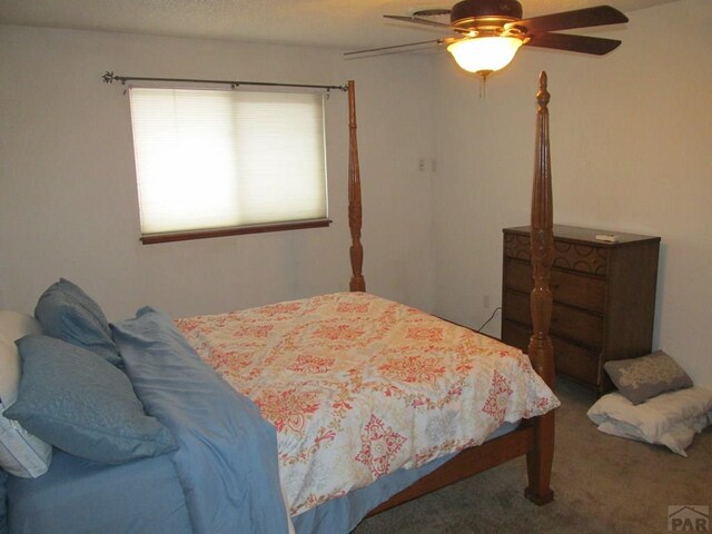 carpeted bedroom with a ceiling fan