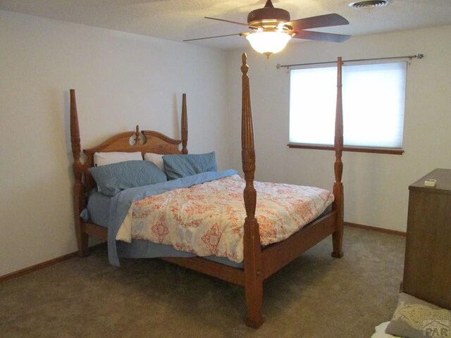 bedroom with carpet, baseboards, and a ceiling fan