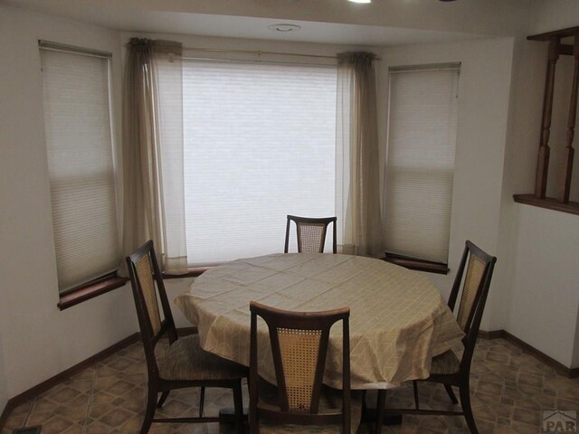 dining room with baseboards