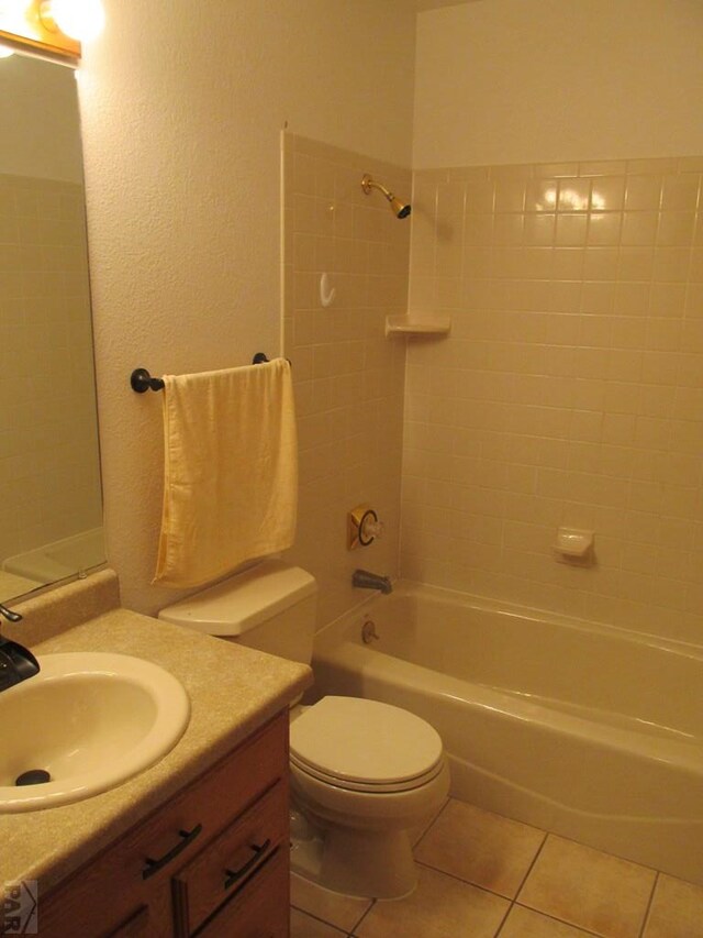 full bathroom with shower / bathing tub combination, vanity, toilet, and tile patterned floors