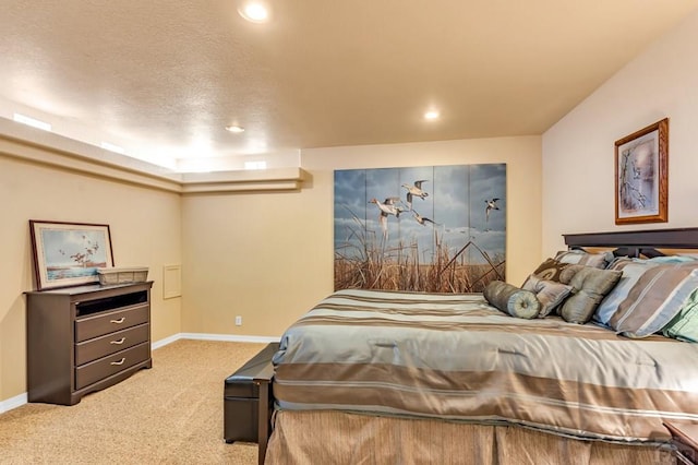 carpeted bedroom featuring recessed lighting, a textured ceiling, and baseboards